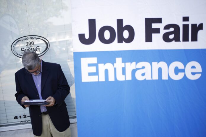 UNITED STATES jobless claims declined by by 15,000 to 202,000 last week. / BLOOMBERG NEWS FILE PHOTO/LUKE SHARRETT