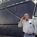 NEW BEDFORD company Blue Harvest announced it has reached an agreement to buy a dozen of boats belonging to Carlos Rafael, pictured above, along with his remaining permits for fish. / AP FILE PHOTO/JOHN SLADEWSKI/STANDARD TIMES