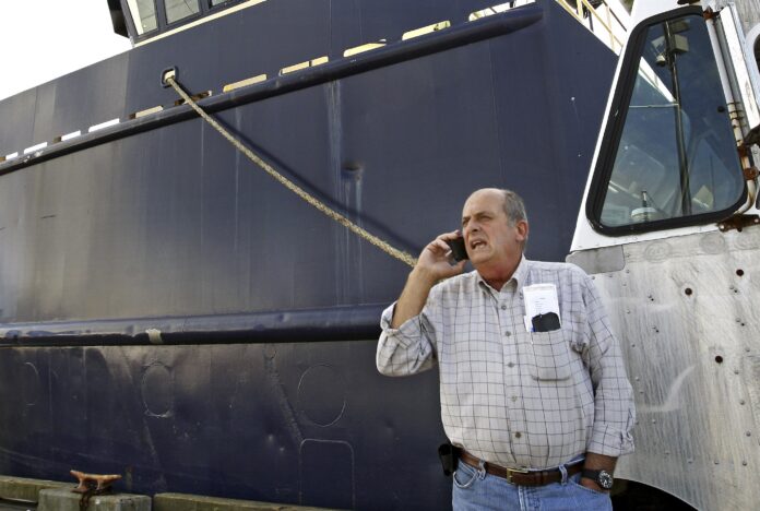 NEW BEDFORD company Blue Harvest announced it has reached an agreement to buy a dozen of boats belonging to Carlos Rafael, pictured above, along with his remaining permits for fish. / AP FILE PHOTO/JOHN SLADEWSKI/STANDARD TIMES