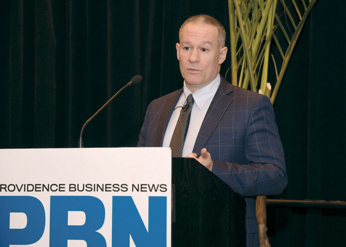 SUNNY OUTLOOK: Thomas Tzitzouris, director for Strategas Research Partners in New York, tells attendees at the Providence Business News Economic Trends Summit that although the year has gotten off to a sluggish start, he predicts a 2% growth rate in the gross national product in 2020. / PBN PHOTO/ MIKE SKORSKI SUNNY OUTLOOK: Thomas Tzitzouris, director for Strategas Research Partners in New York, tells attendees at the Providence Business News Economic Trends Summit that although the year has gotten off to a sluggish start, he predicts a 2% growth rate in the gross national product in 2020. / PBN PHOTO/ MIKE SKORSKI