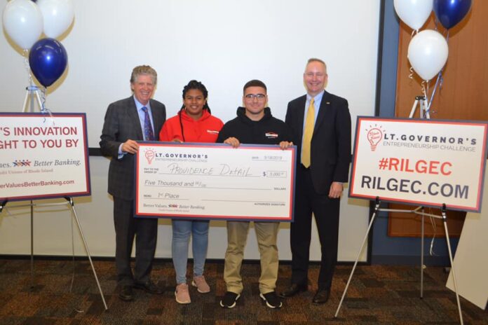 LT. GOV. Dan McKee, left, with Ron McLean, President/CEO of the Cooperative Credit Union Association, right as they present a scholarship to the first place winners of the 2019 Lt. Governor's Entrepreneurship Challenge, Providence Detailing, a pitch team consisting of Alejandro Martinez, center left, and Laila Martin, center right. / COURTESY LT. GOVERNOR'S OFFICE LT. GOV. Dan McKee, left, with Ron McLean, President/CEO of the Cooperative Credit Union Association, right as they present a scholarship to the first place winners of the 2019 Lt. Governor's Entrepreneurship Challenge, Providence Detailing, a pitch team consisting of Alejandro Martinez, center left, and Laila Martin, center right. / COURTESY LT. GOVERNOR'S OFFICE