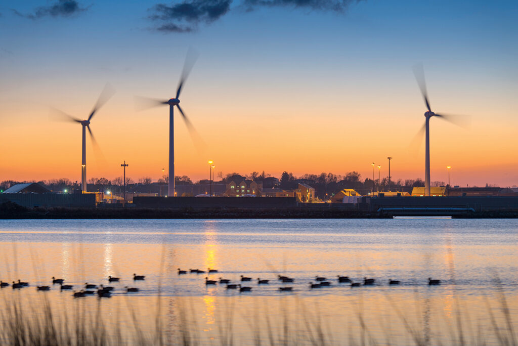 GROWING IN NUMBERS: The three 1.5-megawatt turbines on the Narragansett Bay Commission property along the Providence waterfront may be joined by three more turbines nearby if planned projects by Green Development LLC become reality. / COURTESY PETER GOLBERG FOR NARRAGANSETT BAY COMMISSION