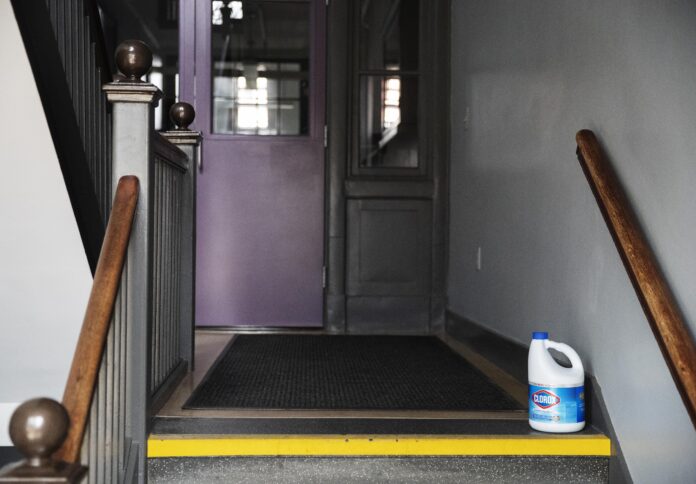 A BOTTLE of bleach sits on the steps of Saint Raphael Academy in Pawtucket. When the new coronavirus surfaced at the school after a group returned from a trip to Italy, officials decided to close it for two weeks. Instead of cancelling classes, the Catholic school instituted 