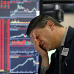 THE S&P 500 dropped about 7% within the first few minutes of Thursday's trading, triggering an automatic halt to trading on the New York Stock Exchange. / AP FILE PHOTO/RICHARD DREW