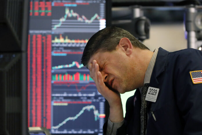THE S&P 500 dropped about 7% within the first few minutes of Thursday's trading, triggering an automatic halt to trading on the New York Stock Exchange. / AP FILE PHOTO/RICHARD DREW
