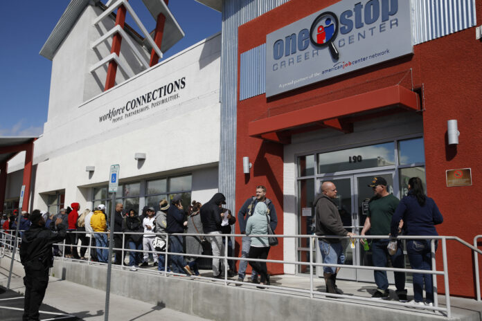 U.S. JOBLESS CLAIMS more than quadrupled the previous record set in 1982, hitting 3.3 million last week. / AP FILE PHOTO/JOHN LOCHER U.S. JOBLESS CLAIMS more than quadrupled the previous record set in 1982, hitting 3.3 million last week. / AP FILE PHOTO/JOHN LOCHER