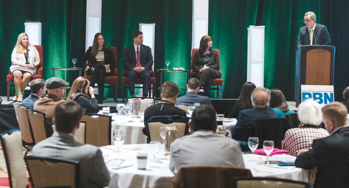 CANNABIS CONVERSATION: PBN editor Michael Mello, right, moderates a panel discussion at PBN’s The Business of Cannabis Summit at the Omni Providence Hotel on Feb. 26, featuring from left: Karyn Rhodes, of Complete HR Solutions; Mitzi Hollenbeck, of Citrin Cooperman; Benjamin L. Rackliffe, an attorney at Pannone Lopes Devereaux & O’Gara; and Kristyn Glennon, of BayCoast Bank. / PBN PHOTO/RUPERT WHITELEY CANNABIS CONVERSATION: PBN editor Michael Mello, right, moderates a panel discussion at PBN’s The Business of Cannabis Summit at the Omni Providence Hotel on Feb. 26, featuring from left: Karyn Rhodes, of Complete HR Solutions; Mitzi Hollenbeck, of Citrin Cooperman; Benjamin L. Rackliffe, an attorney at Pannone Lopes Devereaux & O’Gara; and Kristyn Glennon, of BayCoast Bank. / PBN PHOTO/RUPERT WHITELEY