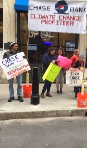 JPMORGAN CHASE & CO. has been criticized by climate activists for investing in fossil fuels, including local activists with Climate Action Rhode Island who have protested branch openings. / COURTESY CLIMATE ACTION RHODE ISLAND