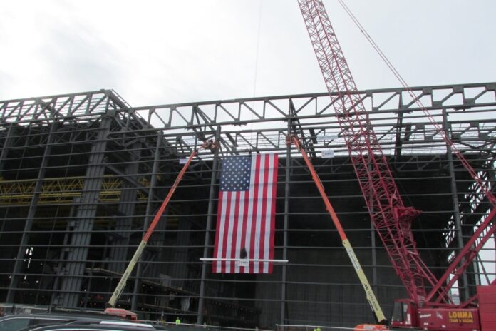 GENERAL DYNAMICS Electric Boat marks the topping off of Building 9B at Quonset Point, part of its shipyard expansion effort. / COURTESY GENERAL DYNAMICS ELECTRIC BOAT