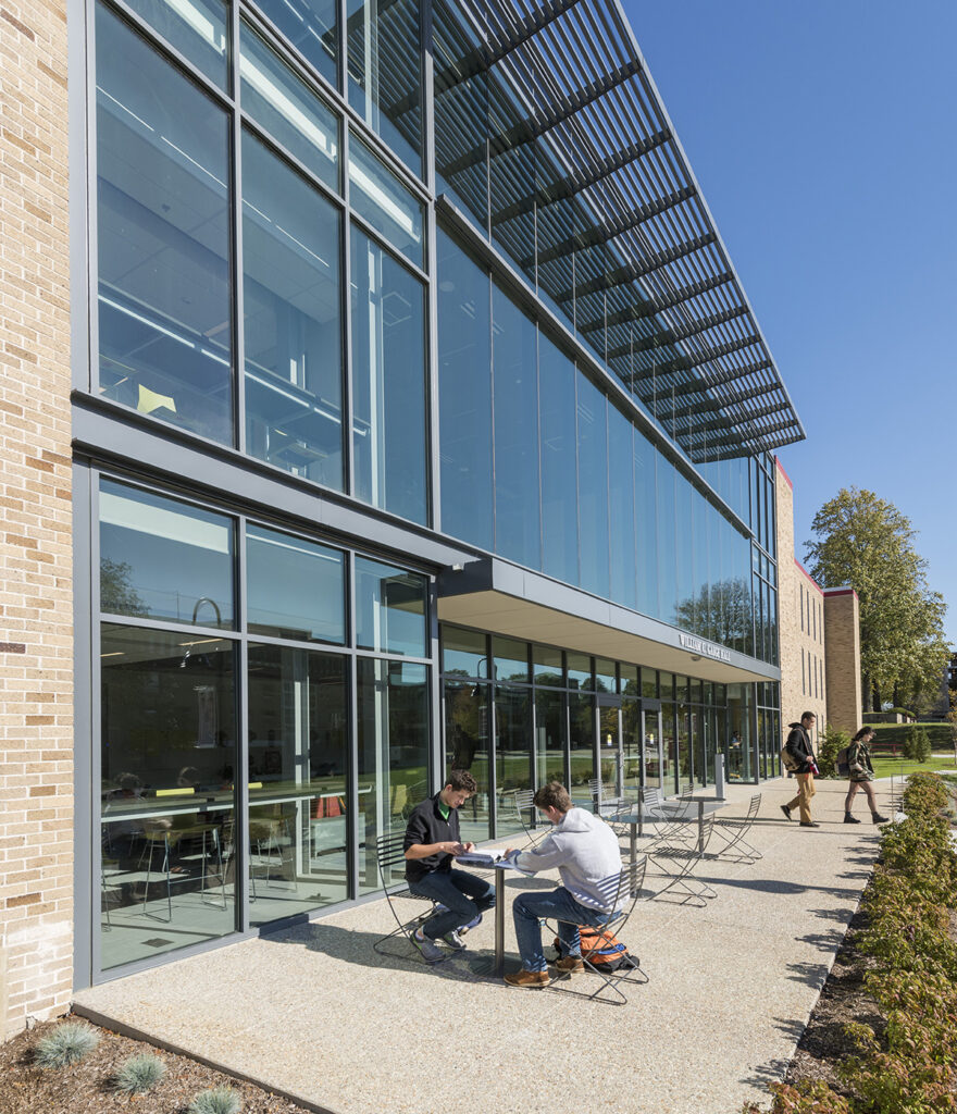 COMMUNITY SPOT: An attractive outdoor gathering space connects visually with the indoor lounge on the first floor of Gaige Hall. 