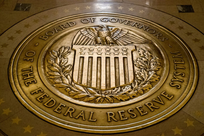THE EMERGENCY CUT in the federal interest rate will squeeze bank profit margins but benefit borrowers. / AP FILE PHOTO/ANDREW HARNIK