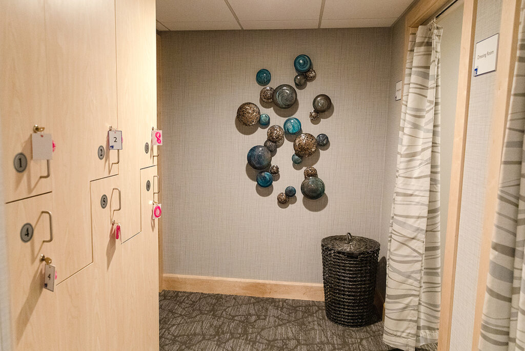 GLASS ART: The walls are adorned with sculptural glass art in the new dressing rooms area of the facility./ COURTESY RHODE ISLAND MEDICAL IMAGING INC.