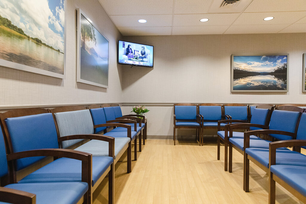 MODERN SETTING: A TV hangs in the corner of the fully renovated waiting room, including new chairs, on the diagnostic side of the facility./ COURTESY RHODE ISLAND MEDICAL IMAGING INC.