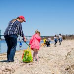 DEBRIS CLEANUP: Volunteers for Clean Ocean Access pick up debris at Pheasant Drive Beach in Portsmouth. The environmental group will hold its annual meeting as a virtual event on May 19. / COURTESY CLEAN OCEAN ACCESS/CATE BROWN 