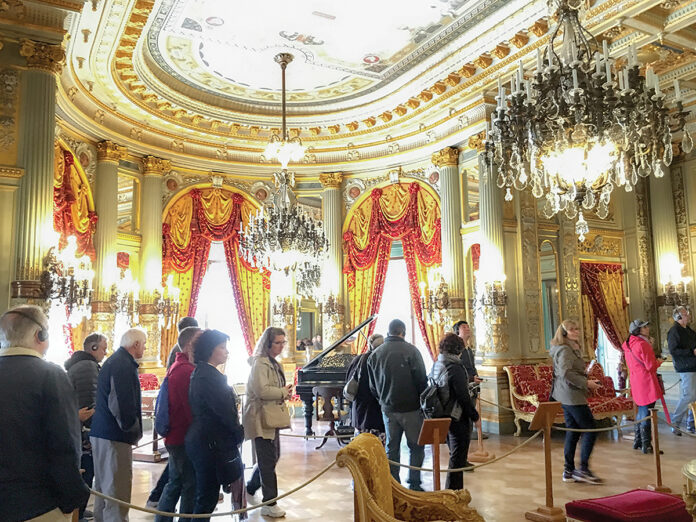 THE WAY IT WAS: Visitors tour the Breakers Mansion in Newport in a time before the coronavirus pandemic. Normally a major tourism draw, the Newport Mansions remain closed, and opening dates haven’t been announced, as of May 20. / COURTESY DISCOVER NEWPORT  