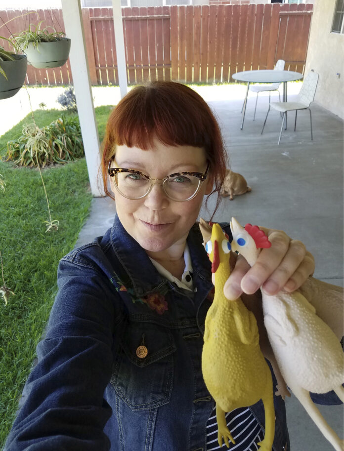 IMPULSE BUY: Melissa Jean Footlick, 42, of San Diego, is among the millions of shoppers behind the surge in online retail sales, sometimes making spur-of-the-moment purchases. For no reason, Footlick purchased a game in which players throw rubber chickens at targets. / MELISSA JEAN FOOTLICK VIA AP
