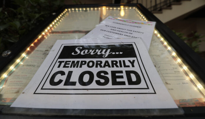 PANDEMIC UNEMPLOYMENT INSURANCE filings in Rhode Island rose by 1,542 on Tuesday. / AP FILE PHOTO/ERIC GAY