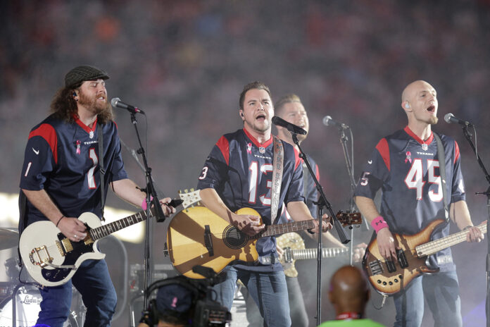 IN THE FLESH: The Eli Young Band perform during halftime of an NFL football game in Houston in 2014. The band will take the stage as part of the Concert in Your Car series in June.  / AP FILE PHOTO/PATRIC SCHNEIDER