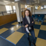 STANDING HER GROUND: Karen Santilli, director of Crossroads Rhode Island, is hopeful that an affordable-housing program included in Gov. Gina M. Raimondo’s initial budget proposal will survive despite the state’s new revenue woes. / PBN PHOTO/MICHAEL SALERNO