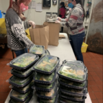 EMPLOYEES AT RED STRIPE restaurant in Providence organize meal packages to be delivered to Roger Williams Medical Center. Encore Restaurant Group and the Ocean State Job Lot Charitable Foundation recently launched its Meals with a Mission program where it will deliver close to 4,000 meals to frontline workers. / COURTESY ENCORE RESTAURANT GROUP