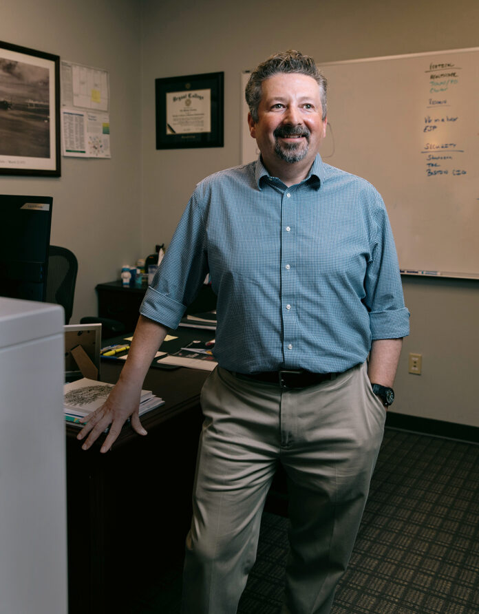 Warwick-based Vertikal6 was formed in 2015 following the merger of Atrion SMB and RhodeOne Technology Solutions. CEO Rick Norberg, who founded RhodeOne as a one-man shop in 2002, now leads a 50-person team focused on helping organizations elevate their technology. / PBN PHOTO/RUPERT WHITELEY Warwick-based Vertikal6 was formed in 2015 following the merger of Atrion SMB and RhodeOne Technology Solutions. CEO Rick Norberg, who founded RhodeOne as a one-man shop in 2002, now leads a 50-person team focused on helping organizations elevate their technology. / PBN PHOTO/RUPERT WHITELEY