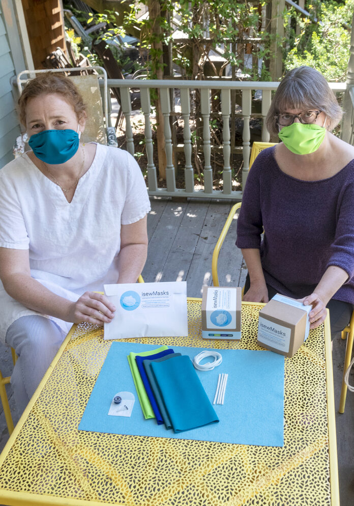 MADE IN R.I.: Cynthia Treen, left, and Clare King, co-owners of isewMasks, use locally sourced materials from Rhode Island-based companies in their do-it-yourself mask-making kits. / PBN PHOTO/MICHAEL SALERNO