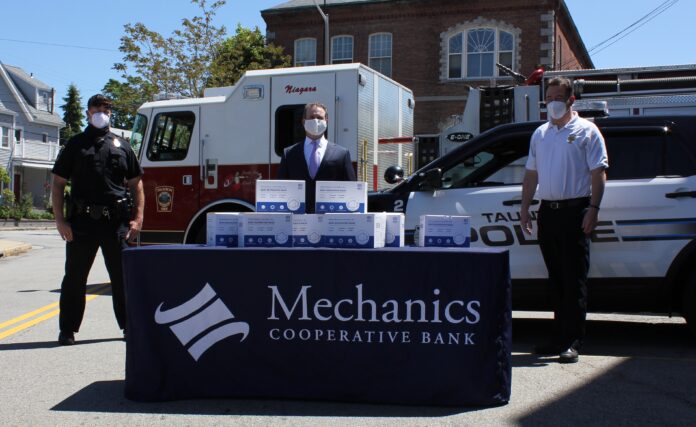 MECHANICS COOPERATIVE BANK recently donated 2,000 KN95 masks to the Taunton Police and Fire departments. Pictured, from left, are Taunton Police Sgt. Eric Nichols, bank CEO and President Joseph T. Baptista Jr., and Taunton Fire Chief Timothy Bradshaw. / COURTESY MECHANICS COOPERATIVE BANK