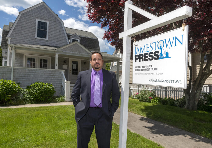 OUT OF POCKET: Robert Berczuk, publisher of The Jamestown Press, says the money his newspaper is losing as a result of a 33% decline in ad revenue is coming directly out of his pocket, but he has assured his staff of six that there will be no pay cuts, layoffs or furloughs. / PBN PHOTO/MICHAEL SALERNO 