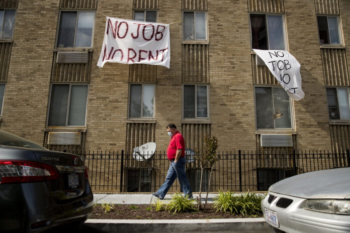 ROUGHLY 30% OF RENTERS polled by the U.S. Census say they have no confidence or slight confidence in their ability to pay rent next month. / AP FILE PHOTO/ANDREW HARNIK