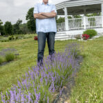 MULTIPURPOSE: Lavender Waves Farm owner Henry Cabrera thought “out of the box” to develop a plot of land in South Kingstown into the farm, which can host overnight guests, as well as weddings, family gatherings and corporate events. / PBN PHOTO/MICHAEL SALERNO