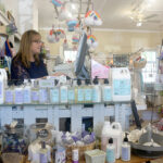 SALES BOOST: Lori Lyons, owner of Beauty and the Bath in North Kingstown, says after boosting the online presence of her gift store as a result of participating in the R.I. Commerce Corp.’s Small Business Technical Support program, she’s expanded the reach of her business and increased her sales by 25%. / PBN PHOTO/ELIZABETH GRAHAM  