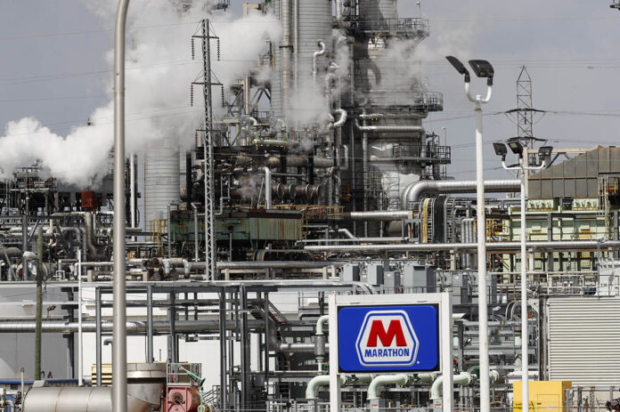 UNCHECKED? A Marathon Petroleum Corp. refinery in Detroit on April 21. Thousands of oil and gas operations and other sites won permission to bypass rules intended to protect health and the environment because of the coronavirus outbreak, The Associated Press has found. / AP FILE PHOTO/PAUL SANCYA UNCHECKED? A Marathon Petroleum Corp. refinery in Detroit on April 21. Thousands of oil and gas operations and other sites won permission to bypass rules intended to protect health and the environment because of the coronavirus outbreak, The Associated Press has found. / AP FILE PHOTO/PAUL SANCYA