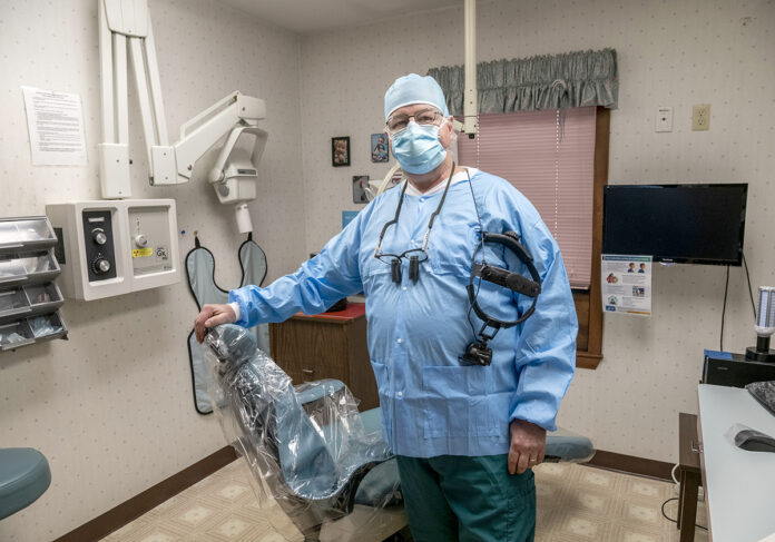 CHANGING TIMES: Dentist Dr. Wayne Mollohan says safety protocols during the pandemic have altered the way dentists do their job, including the teeth-cleaning equipment they use.  / PBN PHOTO/MICHAEL SALERNO