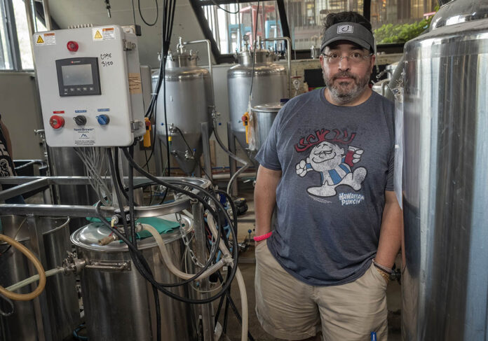 BITTER SITUATION: Providence Brewing Co. owner Efren Hidalgo has received an eviction notice from his landlord for his North Providence brewery. Without enough money to move his equipment to a new location, Hidalgo is worried that if he is forced from his North Providence location immediately, he will default on his sales contracts. / PBN PHOTO/MICHAEL SALERNO