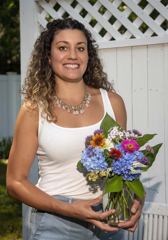 PERSONAL TOUCH: Bloom Back Flowers owner Angela Rotondo believes being a florist means taking time to get to know your clients to build a personalized bouquet. / PBN PHOTO/MICHAEL SALERNO PERSONAL TOUCH: Bloom Back Flowers owner Angela Rotondo believes being a florist means taking time to get to know your clients to build a personalized bouquet. / PBN PHOTO/MICHAEL SALERNO