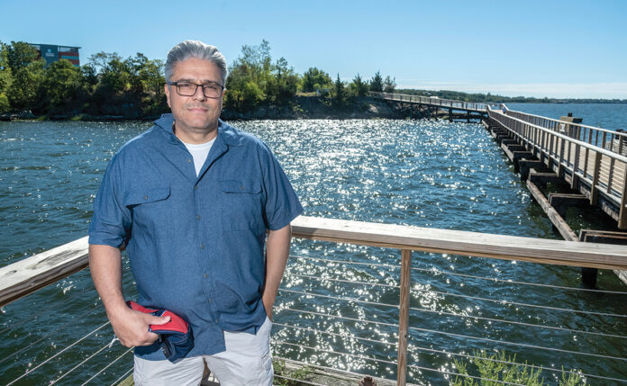 NEW USES: East Providence Mayor Roberto DaSilva says waterfront redevelopment will help the city attract more residents and visitors. He’s pictured on a public pier at the Kettle Point development. / PBN FILE PHOTO/ MICHAEL SALERNO