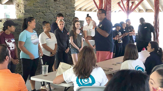 TEAMWORK: Tides Family Services team members work together during a summer retreat in 2019. / COURTESY TIDES FAMILY SERVICES