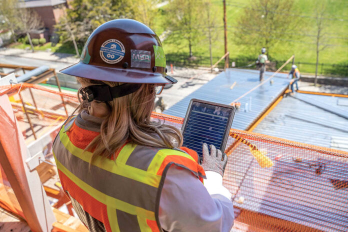 SITE WORK: Shawmut Design and Construction Senior Superintendent Jessica Spivey oversees the ongoing wellness center and residence hall project at Brown University. / COURTESY SHAWMUT DESIGN AND CONSTRUCTION