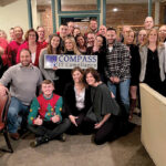 HOLIDAY SPIRIT: Compass IT Compliance LLC employees gather during a Christmas party.  COURTESY COMPASS IT COMPLIANCE LLC