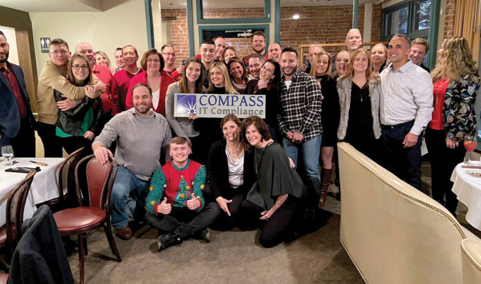 HOLIDAY SPIRIT: Compass IT Compliance LLC employees gather during a Christmas party.
COURTESY COMPASS IT COMPLIANCE LLC HOLIDAY SPIRIT: Compass IT Compliance LLC employees gather during a Christmas party.
COURTESY COMPASS IT COMPLIANCE LLC