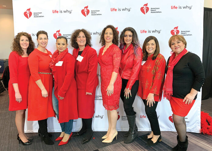 SEEING RED: Providence Community Health Centers Inc. employees wear red and attend a previous American Heart Association Go Red for Women luncheon. / COURTESY PROVIDENCE COMMUNITY HEALTH CENTERS INC. SEEING RED: Providence Community Health Centers Inc. employees wear red and attend a previous American Heart Association Go Red for Women luncheon. / COURTESY PROVIDENCE COMMUNITY HEALTH CENTERS INC.