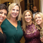 HAPPY HOLIDAYS: Staffers with Kahn, Litwin, Renza & Co. Ltd. attend a holiday party. / COURTESY KAHN, LITWIN, RENZA & CO. LTD.