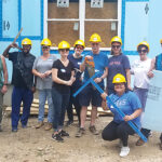 BUILDING BLOCKS: AAA Northeast employees volunteer to build a home for Habitat for Humanity. / COURTESY AAA NORTHEAST