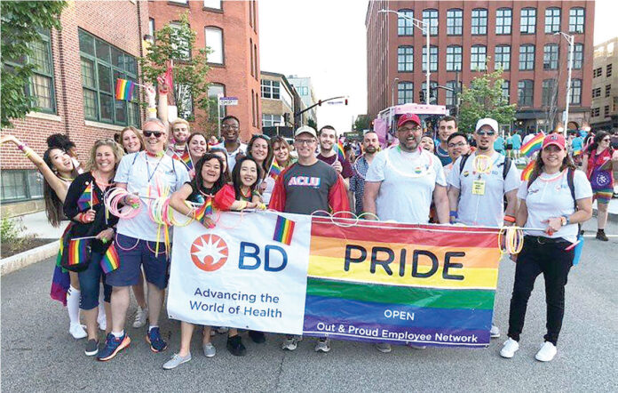 SHOWING PRIDE: Multiple Becton, Dickinson and Co. employees participate in a recent Providence PRIDE parade. / COURTESY BECTON, DICKINSON AND CO.