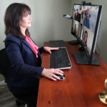 TEAMING UP: Karen Penticost, Envision Technology Advisors LLC vice president of development and operations, collaborates in real time with other Envision members on a Microsoft Teams meeting. / COURTESY ENVISION TECHNOLOGY ADVISORS LLC