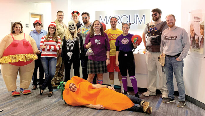 IN CHARACTER: Marcum LLP employees dress up in costumes for Halloween at the office. / COURTESY MARCUM LLP