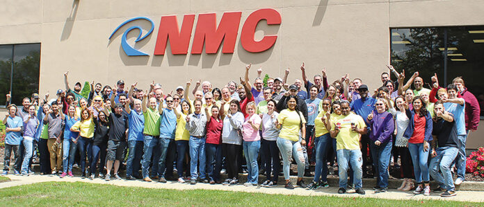 GROWING UP: National Marker Co. employees are happy about breaking sales records for the last three months at the North Smithfield-based manufacturer.  COURTESY NATIONAL MARKER CO.