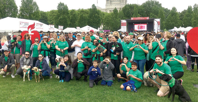 BEST FOOT FORWARD: Neighborhood Health Plan of Rhode Island’s Team Neighborhood members and pets participate in the 2019 American Heart Association of Southern New England Heart Walk in Providence. / COURTESY NEIGHBORHOOD HEALTH PLAN OF RHODE ISLAND