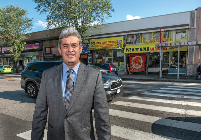 LATINO ADVOCATE: Oscar Mejias, CEO of the Rhode Island Hispanic Chamber of Commerce, stands along Westminster Street in the Olneyville section of Providence that features an enclave of Latino-owned businesses.  / PBN PHOTO/MICHAEL SALERNO