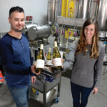ALTERNATIVE PACKAGING: James Davids and Marissa Stashenko, co-owners of negociant winery Enotap LLC in East Providence, say using more-responsible packaging, such as cans and kegs, is better for the environment and costs less for consumers. / PBN PHOTO/ELIZABETH GRAHAM
